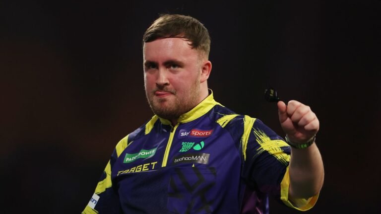 “Luke Littler Successfully Starts Title Defense in PDC World Darts Championship”
